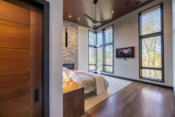 Primary bedroom looking out at wooded lot Primary bedroom looking out at wooded lot