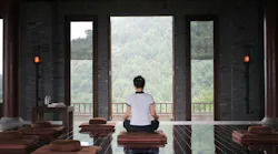 Image of a person doing yoga in a luxury home Image of a person doing yoga in a luxury home
