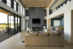 In summer, the bifold doors retract to create a seamless connection between the great hall and the patio. In summer, the bifold doors retract to create a seamless connection between the great hall and the patio.