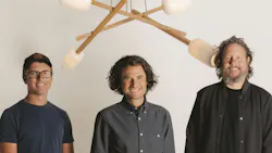 Headshot of the founders of Cerno Group, with one of their chandeliers in the background Headshot of the founders of Cerno Group, with one of their chandeliers in the background
