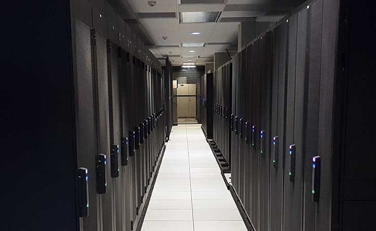 Servers and cabinets inside a containment system in a data center in San Diego. (Photo: Rich Miller)