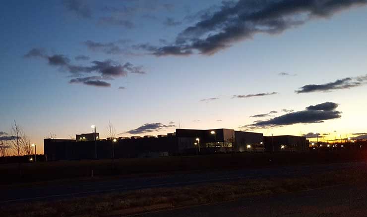 The sun sets behind a data center in Ashburn, Virginia. (Photo: Rich Miller)