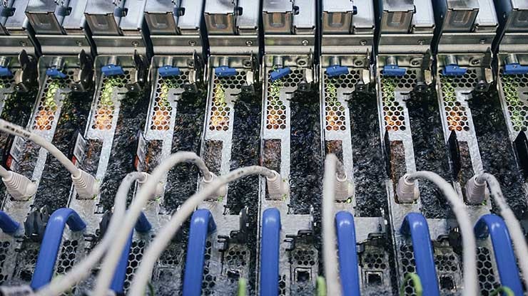 Boiling liquid carries away heat generated by computer servers at a Microsoft datacenter. Microsoft is the first cloud provider to run two-phase immersion cooling in a production environment. Photo by Gene Twedt for Microsoft.