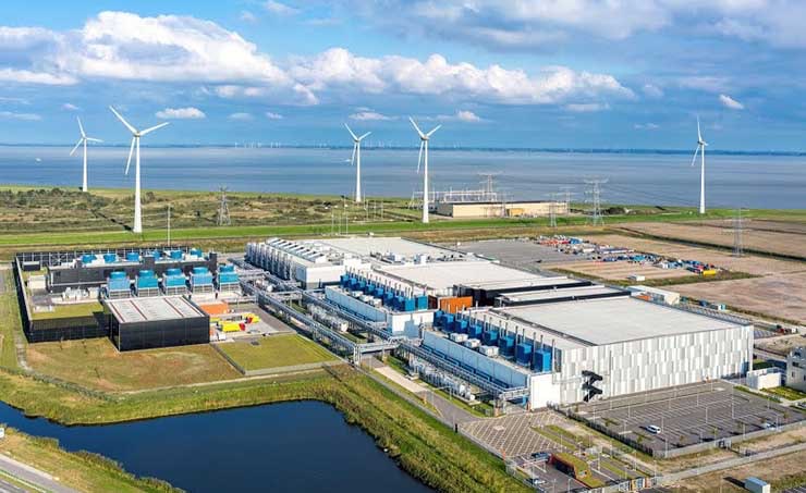The Google data center campus at Eemshaven in the Netherlands, with nearby wind turbines in the background. (Photo: Google)