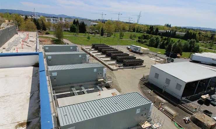 Prefabricated electrical modules being installed at the side of a vault at the NTT Global Data Centers campus in Hillsboro, Oregon. (Photo: NTT Global Data Centers)