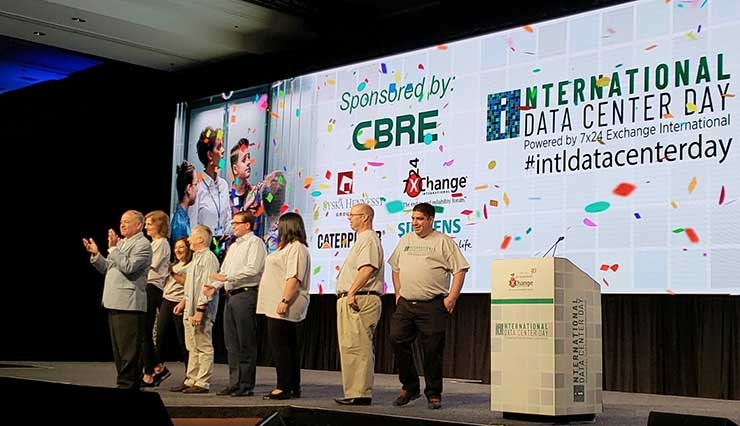 The 7&times;24 Exchange team celebrates International Data Center Day during the livestream of Tuesday&rsquo;s festivities in Phoenix. (Photo: Rich Miller)