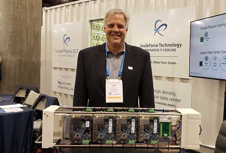 Forced Physics CEO and founder Scott Davis with a server assembly with servers attached to both sides of the Forced Physics JouleForce Conductor cooling unit. (Photo: Rich Miller)