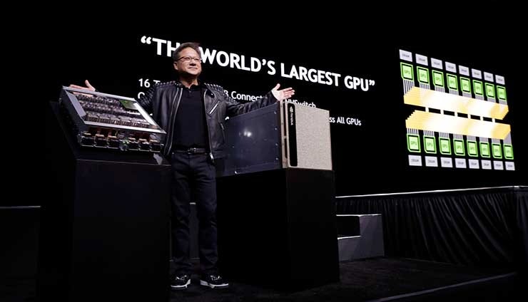 NVIDIA founder and CEO Jensen Huang shows off new hardware for the DGX-2, the upgraded version of the company&rsquo;s desktop supercomputer. (Photo: NVIDIA Corp.)