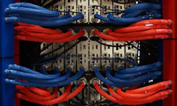 The rear view of a rack of servers using the LiquidCool immersion system. Blue lines bring dielectric coolant to the server to cool components, while the red lines return the fluid to a heat exchanger. (Photo: LiquidCool Solutions) The rear view of a rack of servers using the LiquidCool immersion system. Blue lines bring dielectric coolant to the server to cool components, while the red lines return the fluid to a heat exchanger. (Photo: LiquidCool Solutions)