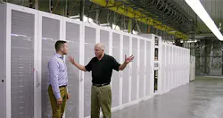 Microsoft’s Christian Belady (right) among the server aisles of the company’s newest data center in Quincy, Washington with Microsoft’s Alex Bradley, Visible behind Belady is a fan wall, one of the new wrinkles in the Generation 5 data center design. (Image: Microsoft) Microsoft’s Christian Belady (right) among the server aisles of the company’s newest data center in Quincy, Washington with Microsoft’s Alex Bradley, Visible behind Belady is a fan wall, one of the new wrinkles in the Generation 5 data center design. (Image: Microsoft)