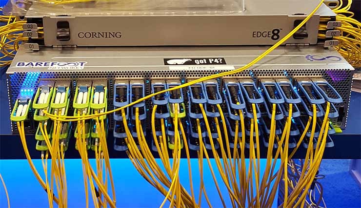 At Open Compute, Intel and Barefoot Networks demonstrated a programmable 6.5 Tb/s Wedge 100 switch using 65 silicon photonics transceivers. (Photo: Rich Miller)