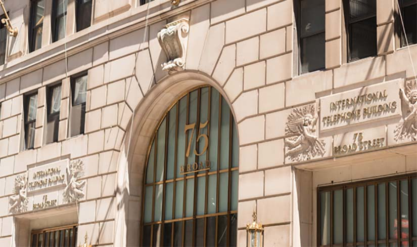The exterior of 75 Broad Street, a telecom and data center building in New York City.