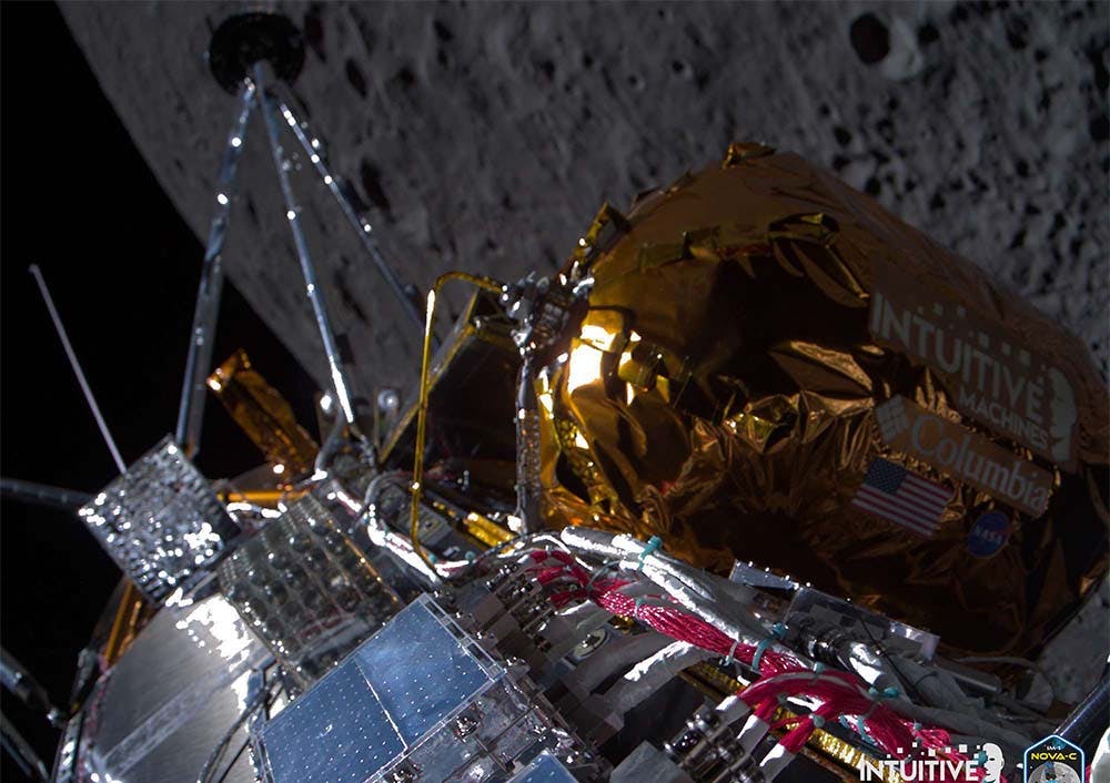 Odysseus lander in orbit above the moon, with the moon in the background.