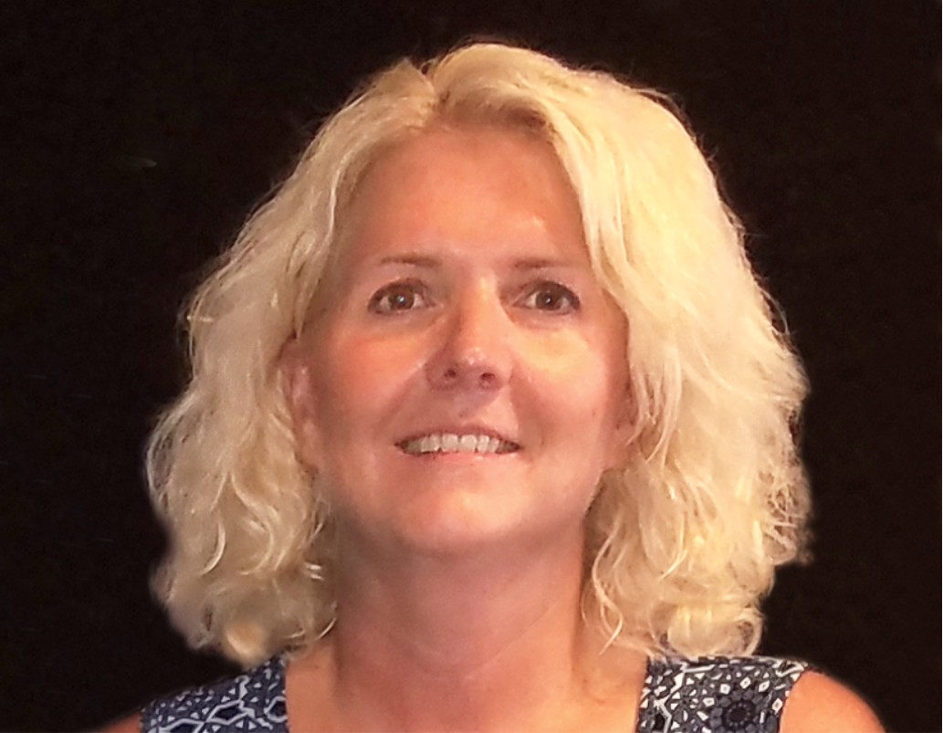 Figure 1: Marcy&rsquo;s &ldquo;before&rdquo; photo shows large masseters and a strained smile because of her orofacial pain.