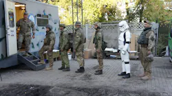A queue of soldiers (one even sporting a Star Wars costume) for mobile dental clinic Tryzub Dental. A queue of soldiers (one even sporting a Star Wars costume) for mobile dental clinic Tryzub Dental.