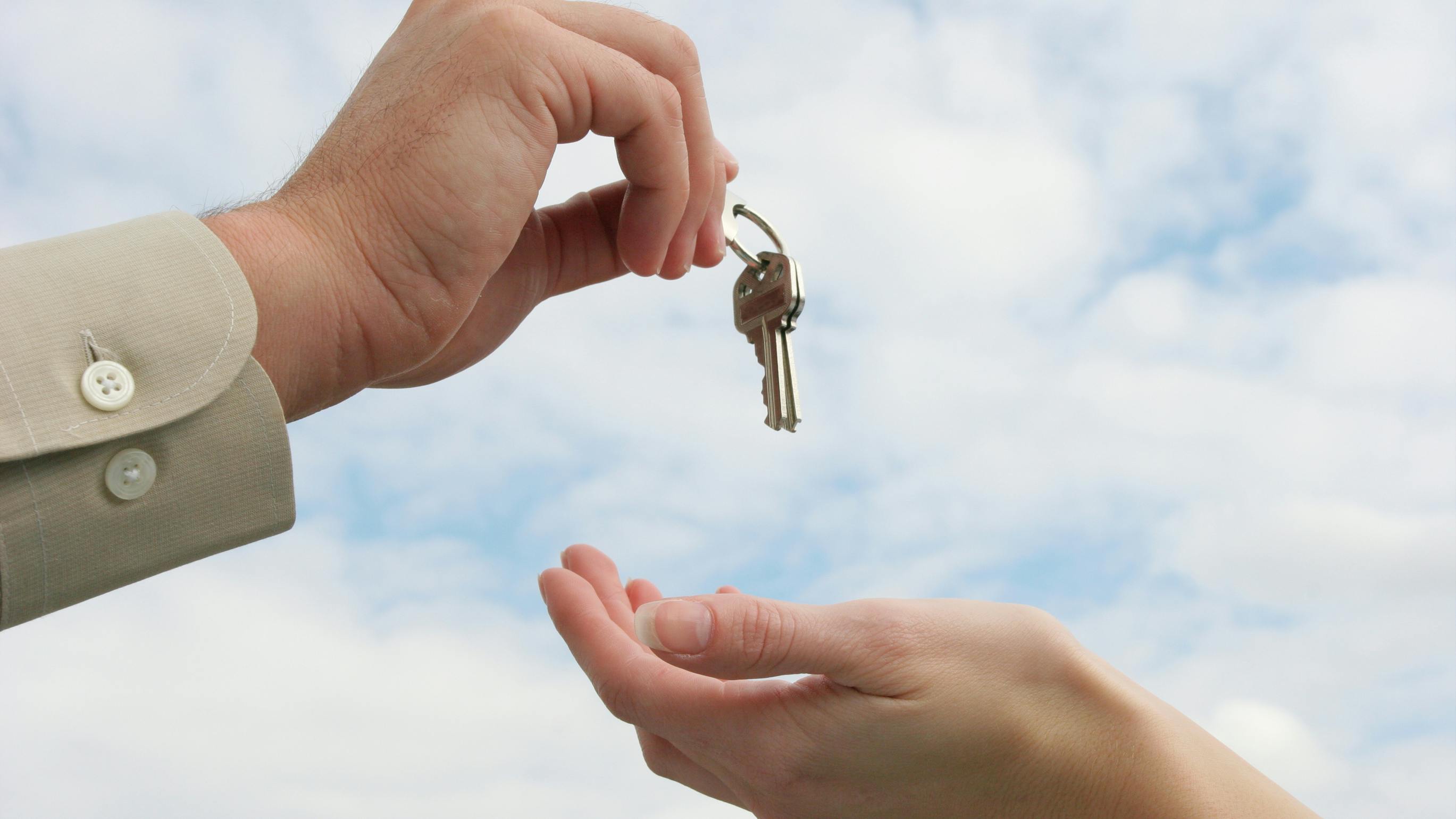 Person handing over keys