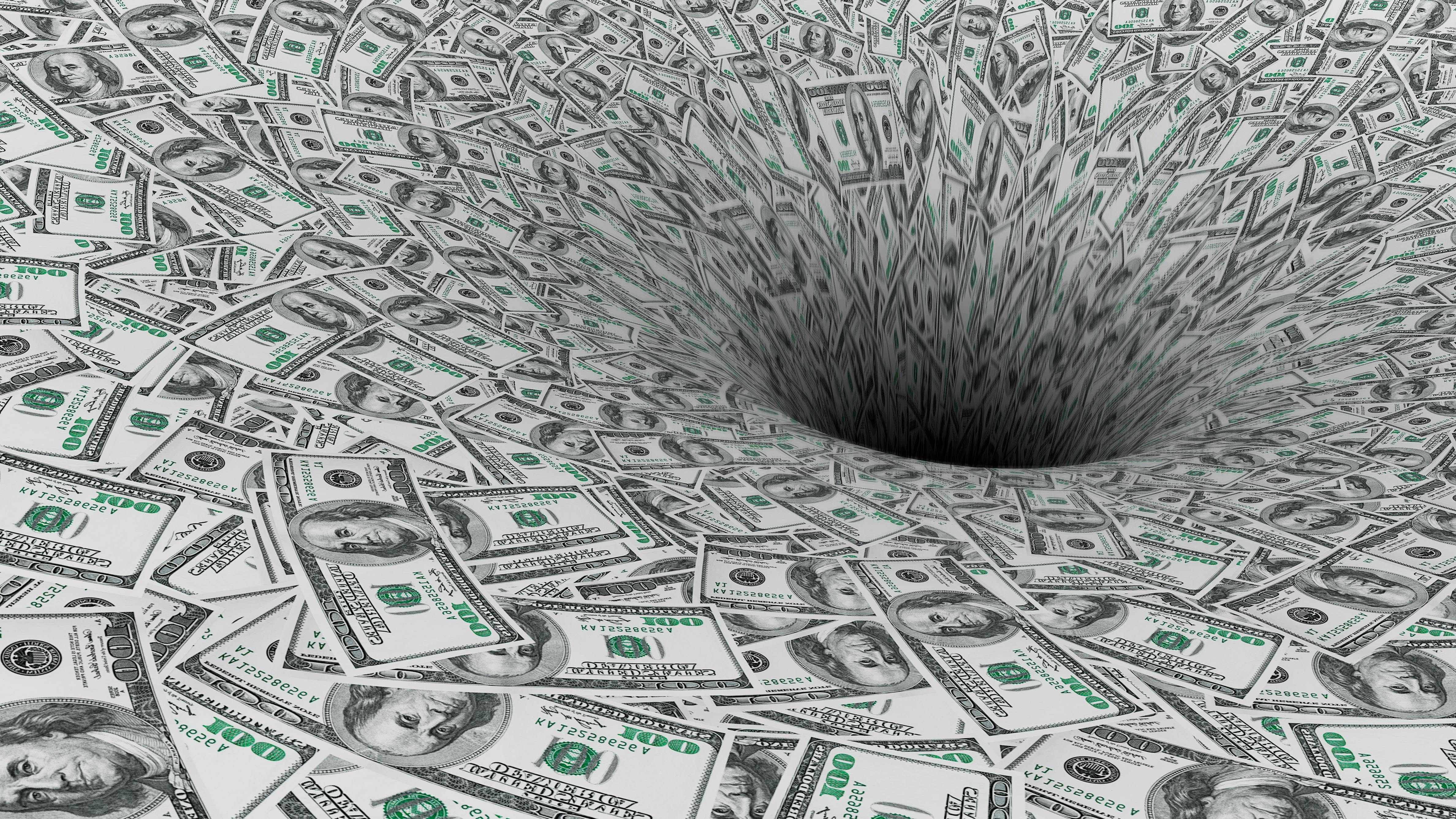 One hundred dollar bills being sucked into a black hole