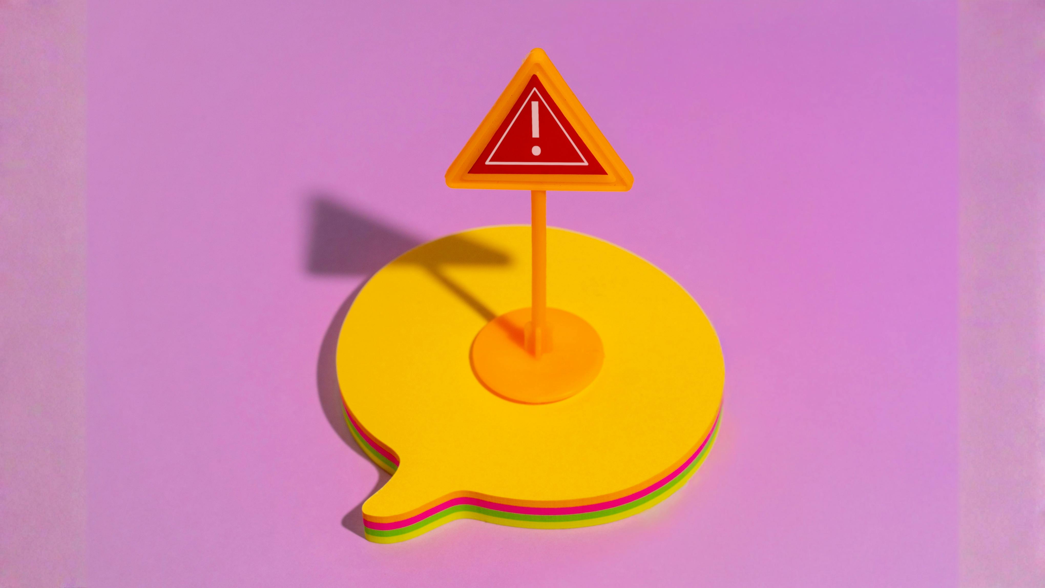 Illustration of a chat bubble with an exclamation point in the middle