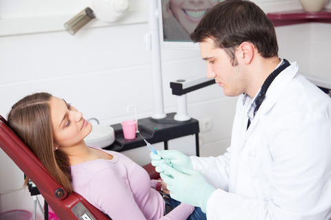 Young Dentist With Pt