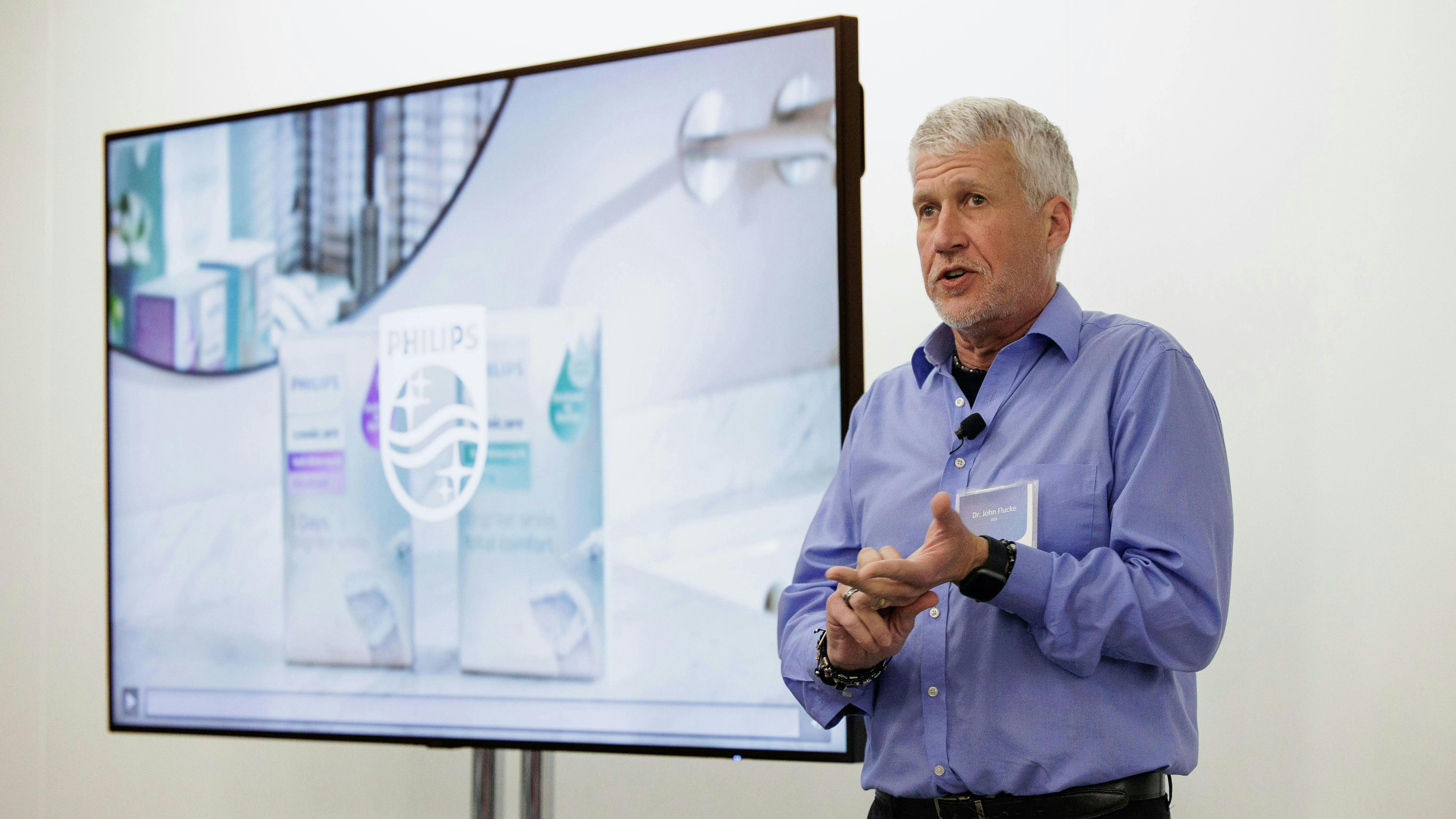 John Flucke, DDS, presents the key features of Philips Sonicare Teeth Whitening Kits and demonstrates the product during a launch event at Chicago Midwinter on February 23, 2024.