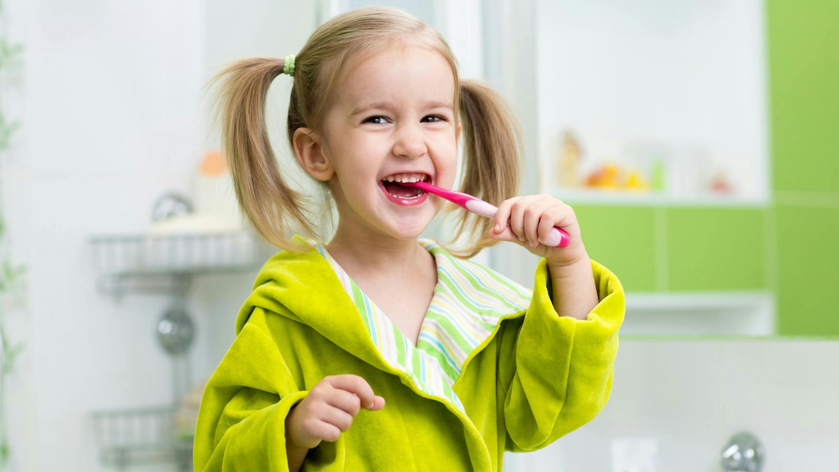 Little girl brushing her teeth