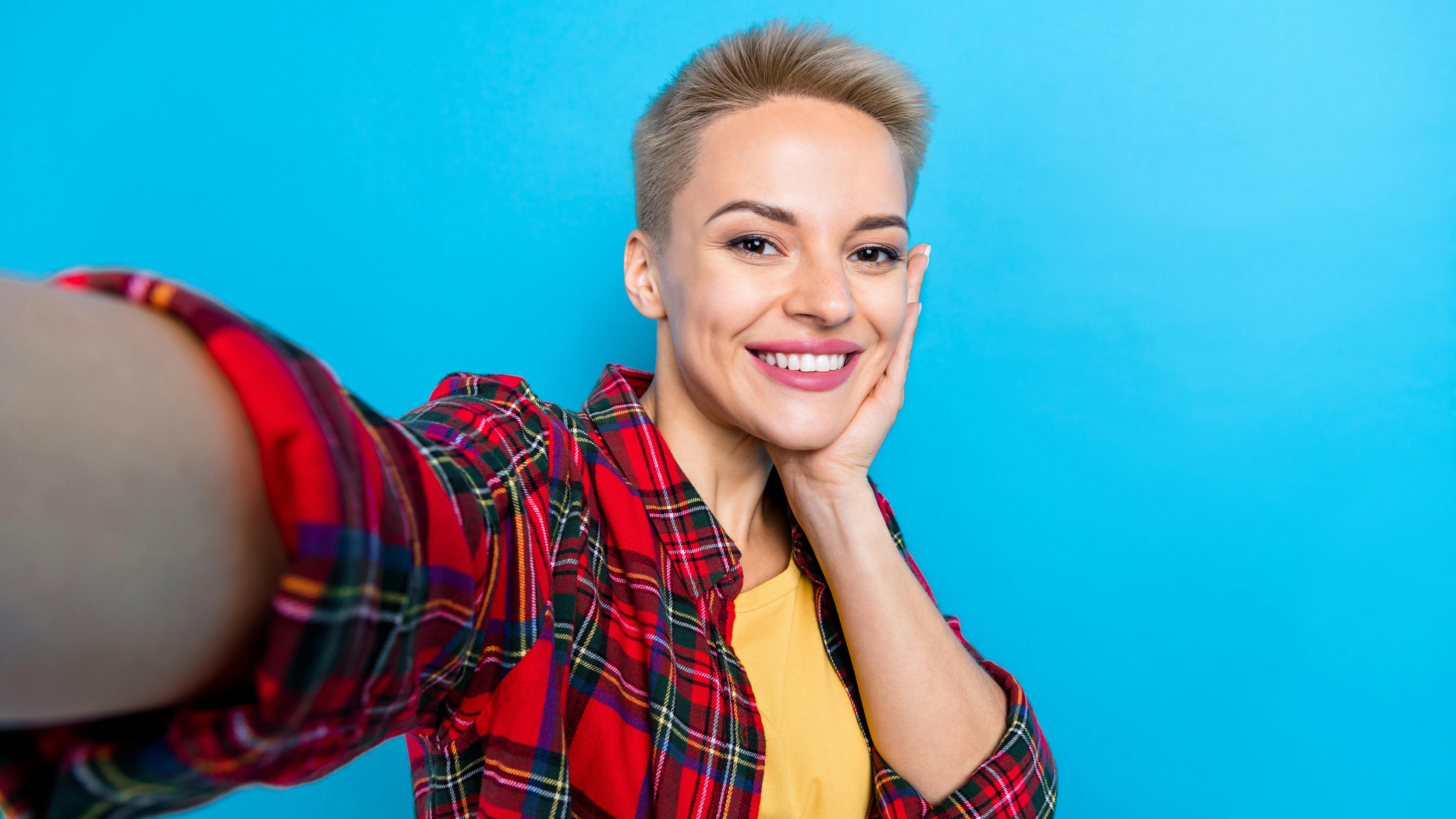 Woman with veneers posing for a selfie