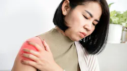 woman experiencing shoulder pain woman experiencing shoulder pain