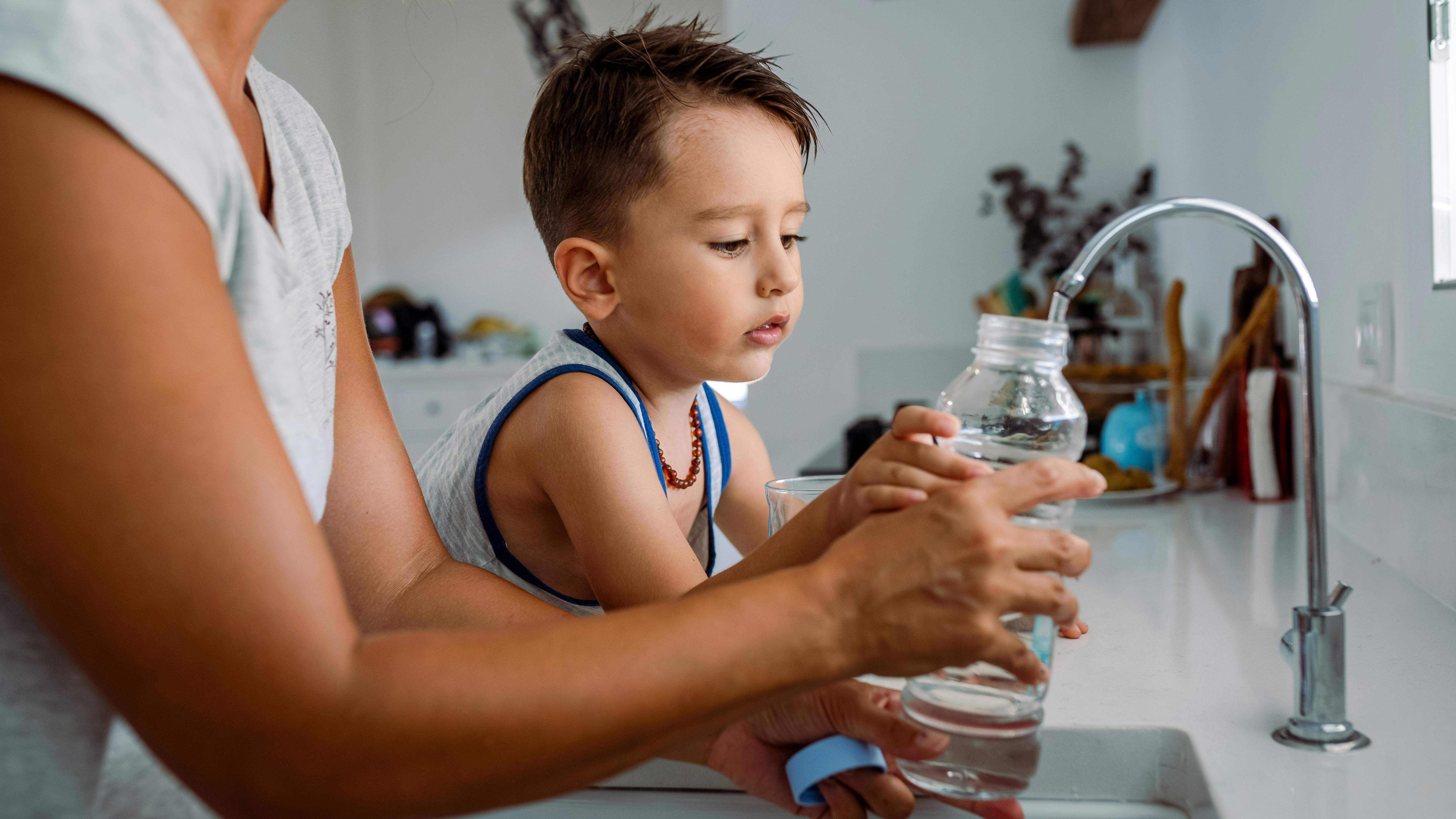 Mother and son drinking water
