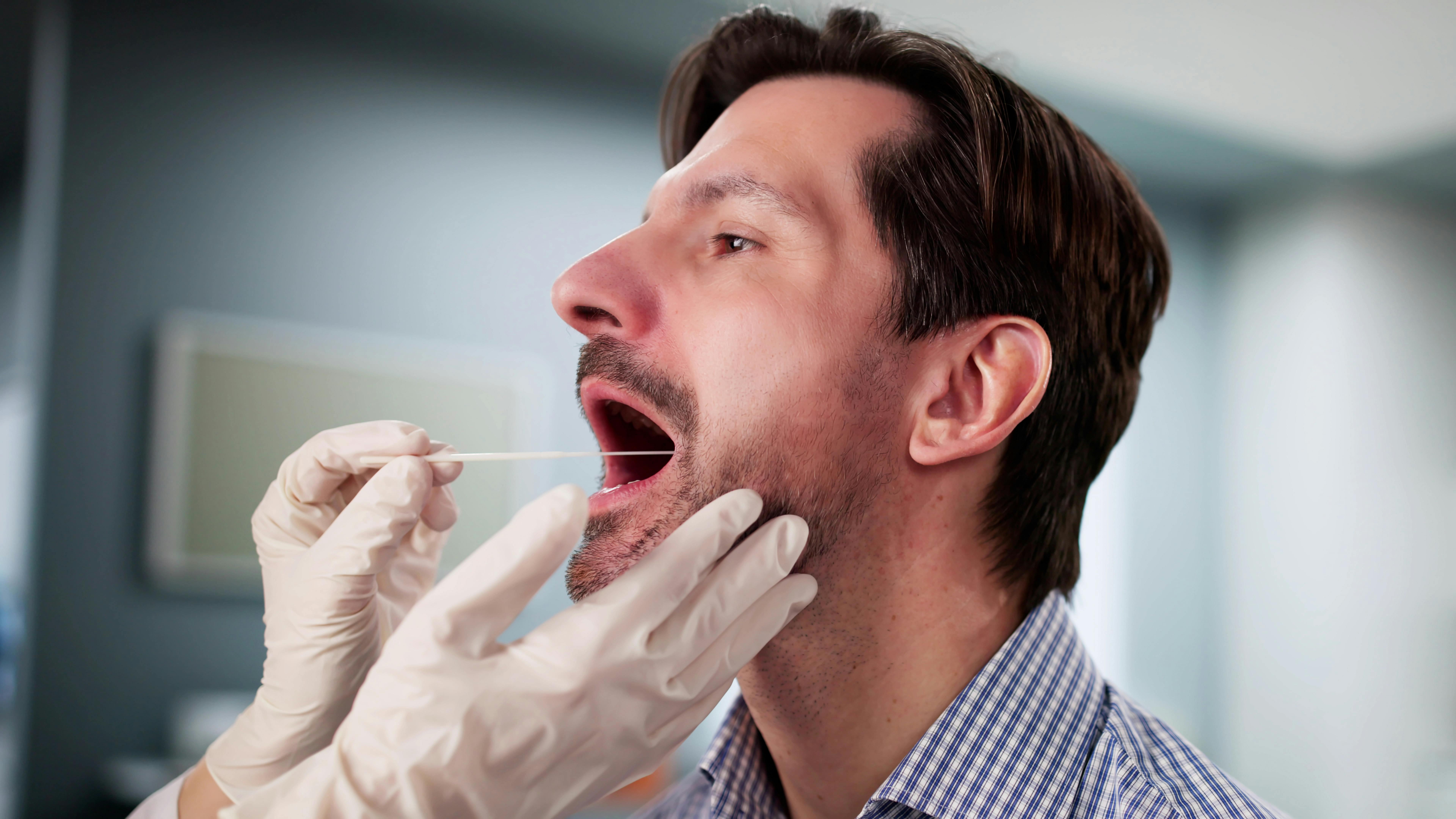 man getting salivary test