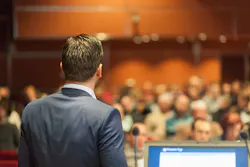 man giving presentation to audience man giving presentation to audience