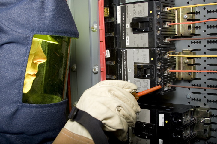 Electrician in protective equipment