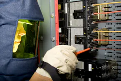 Electrician in protective equipment Electrician in protective equipment