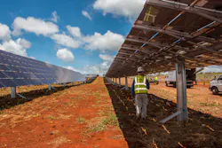 An electrician checks the connections for Clearway Energy Group’s 49MW Kawailoa Solar project located in Oahu, Hawaii. An electrician checks the connections for Clearway Energy Group’s 49MW Kawailoa Solar project located in Oahu, Hawaii.