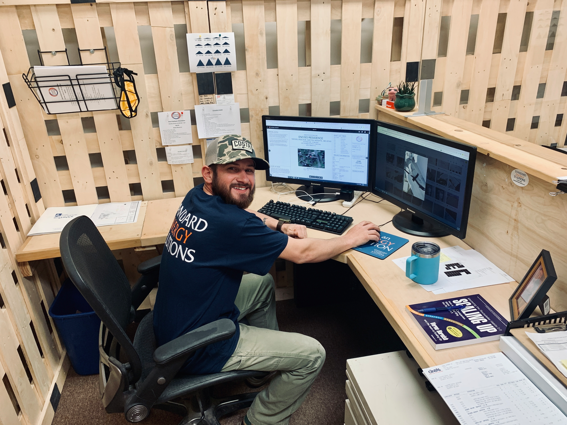 Michael Miller is coordinating the installation of a 108-panel ground-mount solar system for Standard Energy Solutions.