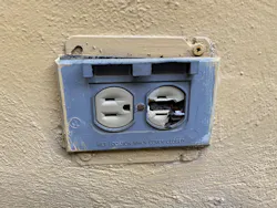 Damaged electrical outlet and receptacle on an outdoor wall Damaged electrical outlet and receptacle on an outdoor wall