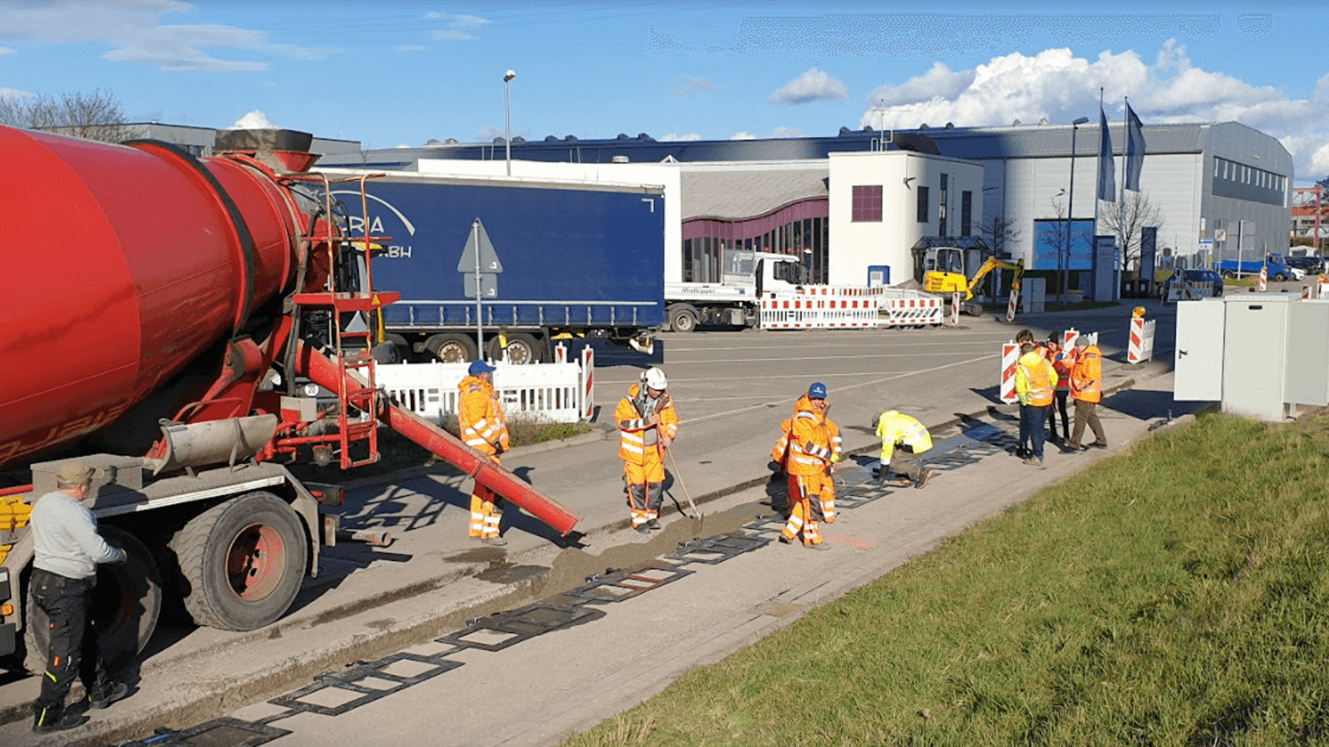 Workers lay components of an Electreon in-road wireless charging project for a bus line in Karlsuhe, Germany in 2020.