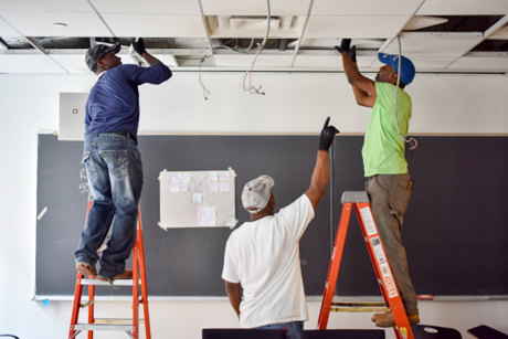 Contractors install a connected lighting system in an NGLS Living Lab.