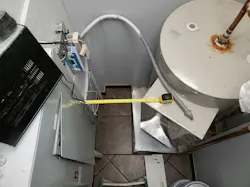 Photo 1. Since a water heater encroaches on the dedicated electrical space, this panel will obviously be problematic to work on. Photo 1. Since a water heater encroaches on the dedicated electrical space, this panel will obviously be problematic to work on.