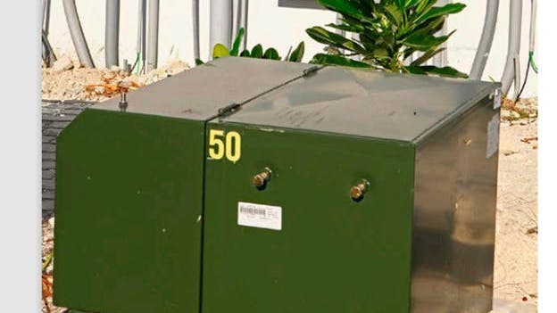 A pad-mount distribution transformer.
