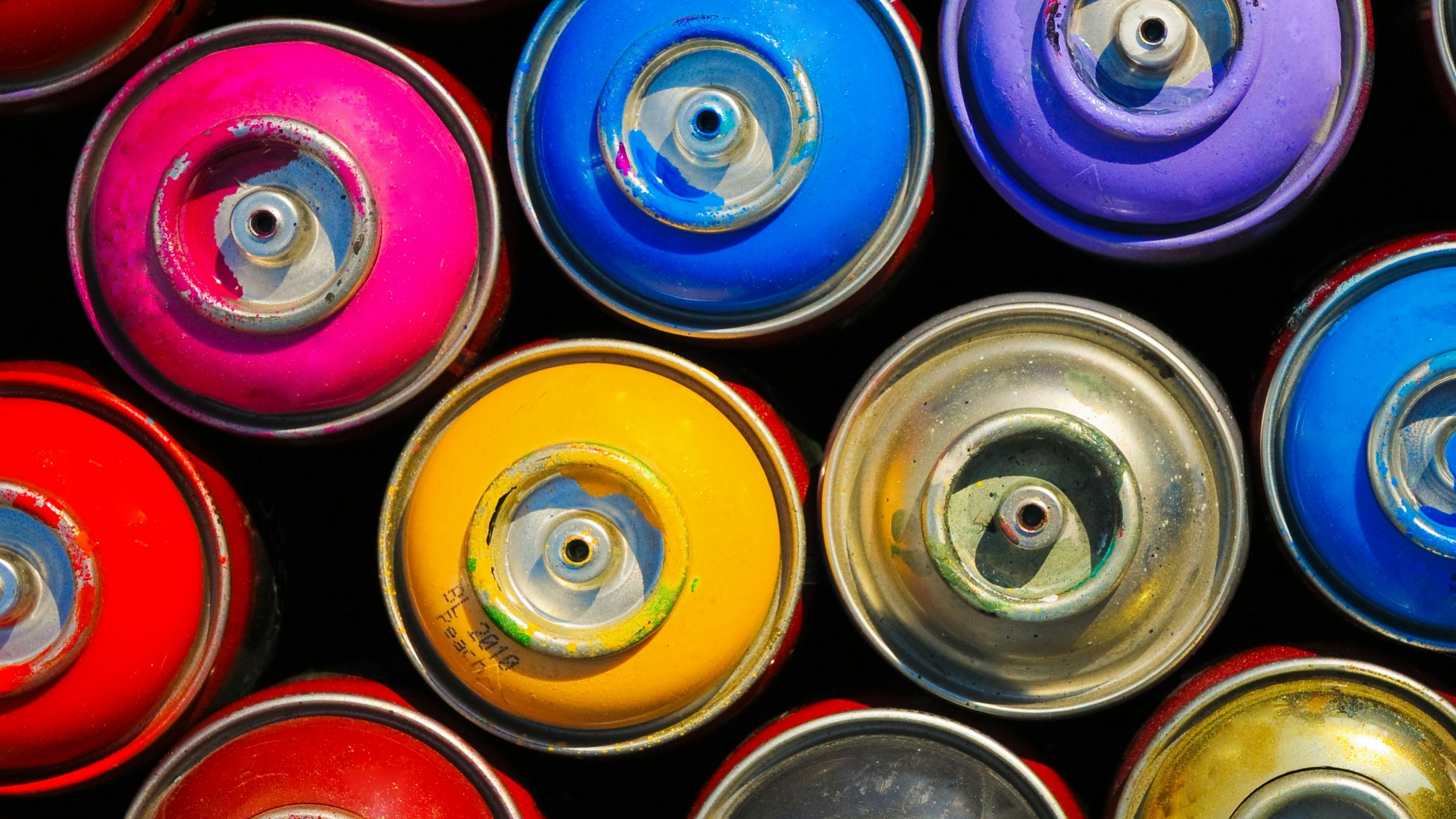 Paint cans. Background of multi-colored containers for paint