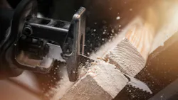 Reciprocating Saw Wood Work. Reciprocating Saw in Action Closeup Photo. Power Tool Wood Cutting Construction Theme. Reciprocating Saw Wood Work. Reciprocating Saw in Action Closeup Photo. Power Tool Wood Cutting Construction Theme.