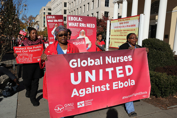 Registered nurses march on Nov 12 in Washington DC as part of Global Ebola Awareness Day