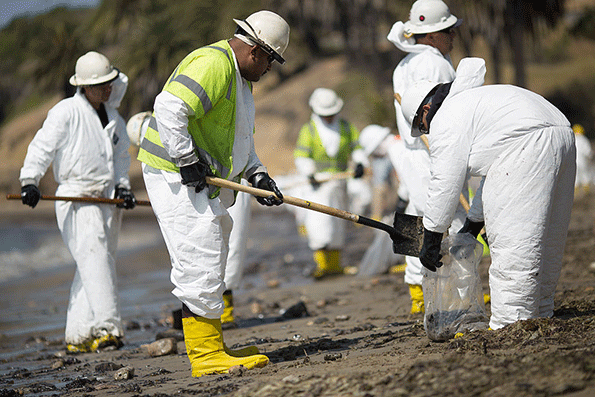 A crew cleans oil from the beach at Refugio State Beach on May 20 2015 north of Goleta Calif About 21000 gallons spilled from an abandoned pipeline on the land near Refugio State Beach spreading over four miles of beach within hours The largest oil spill ever in US waters at the time it occurred in the same section of the coast where numerous offshore oil platforms can be seen giving birth to the modern American environmental movement