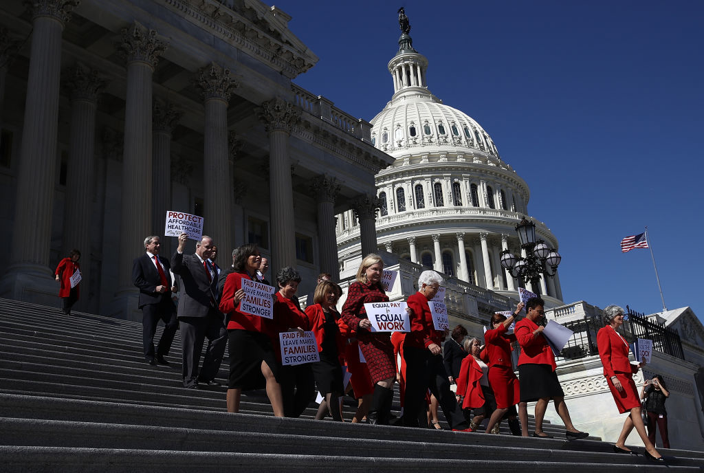 WASHINGTON DC Women members of the House Democratic caucus walk down the steps of the House of Representatives on their way to a press conference marking International Women39s Day and A Day Without a Woman March 8 2017 at the US Capitol in Washington DC During remarks House Minority Leader Nancy Pelosi urged continued efforts to strengthen women39s rights across the country