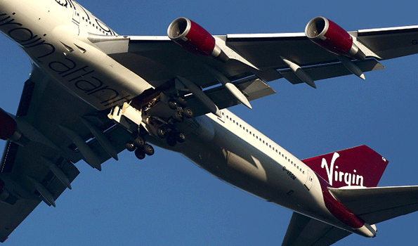 A Virgin Atlantic Boeing 747 jumbo jet passenger plane hovers in the sky as it prepares for a nonstandard landing at Gatwick airport in West Sussex on Dec 29 2014 in London Flight VS43 was traveling to Las Vegas returned to the airport due to a reported technical issue with one of the landing gears