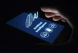 hand grasping smartphone that has a projection of the words artificial intelligence (AI) and symbols of a human head, computer screen and gears hand grasping smartphone that has a projection of the words artificial intelligence (AI) and symbols of a human head, computer screen and gears