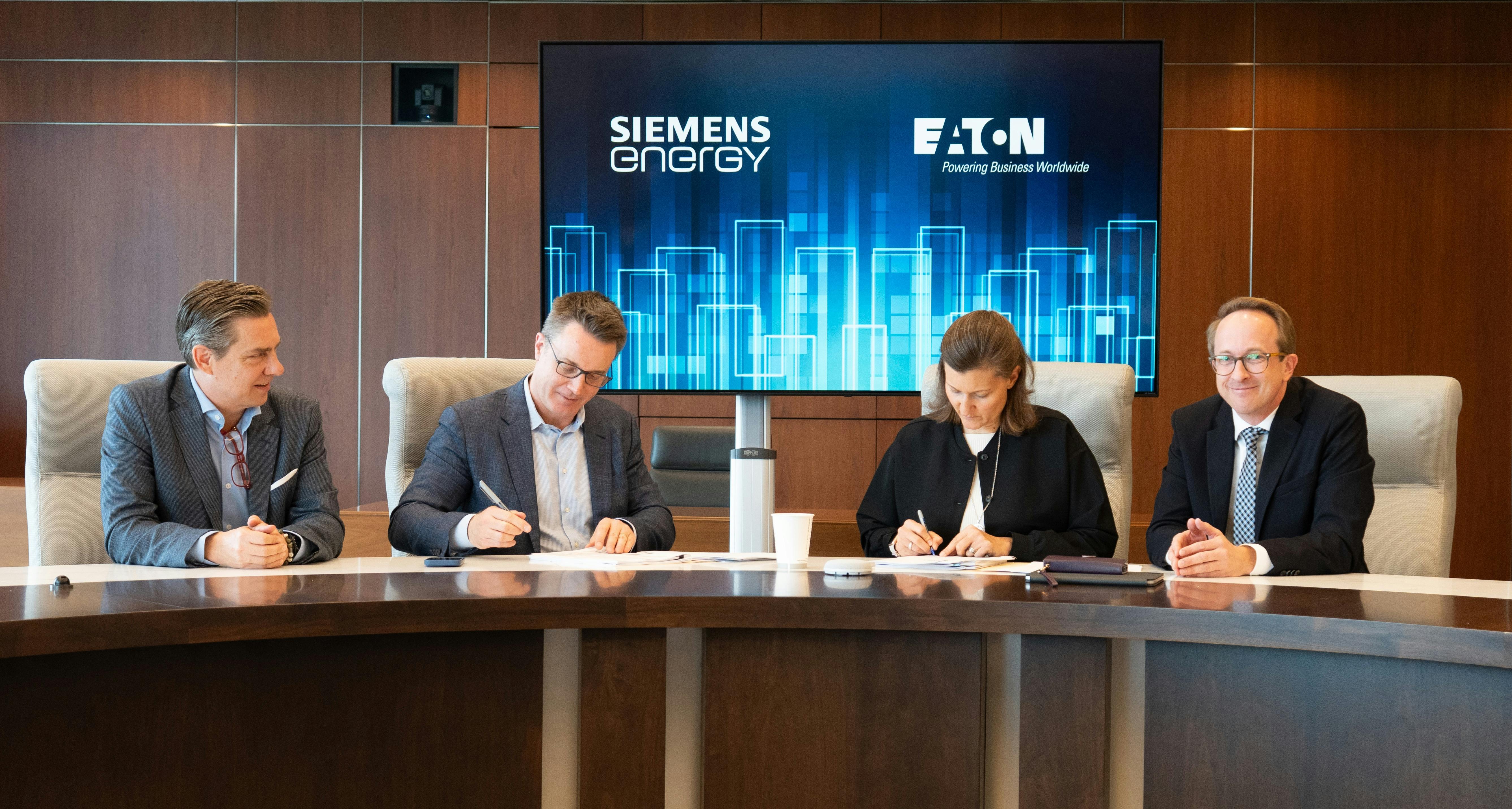 Eaton and Siemens Energy leaders signed an agreement aimed at accelerating data center development with grid-independent energy supplies and standardized modular power systems. Pictured (from left to right) are Heath Monesmith, president and chief operating officer, Electrical Sector, Eaton; Paulo Ruiz, chief executive officer, Eaton; Vanessa Bauch, senior vice president, distributed gas services, Siemens Energy; and Thomas Frank, global head of markets, gas services, Siemens Energy. Image courtesy of Eaton.