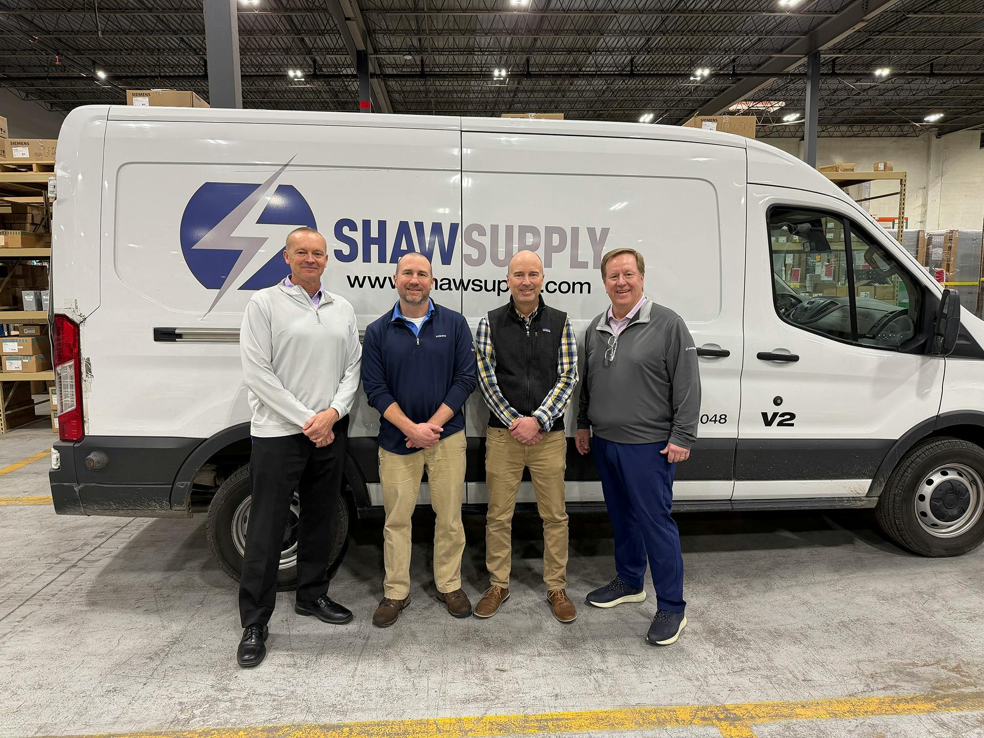 Echo Electric/Sonepar's acquisition of KC's Shaw Electric was one of the two big acquisitions over the past two weeks. (Left-to-right) Chris Scarbrough, president Echo Electric; Brian and Patrick Shaw, co-owners of Shaw Supply; and Andy Waring, Central Region president of Sonepar USA.