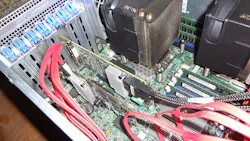 Figure 6. The MegaRAID 9361-8i board (right) was installed next to another LSI SAS controller (left) that was handling the 3.5-in hard drives. Figure 6. The MegaRAID 9361-8i board (right) was installed next to another LSI SAS controller (left) that was handling the 3.5-in hard drives.