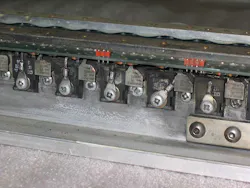 5. This electric-car motor controller prototype uses the busbars as heat sinks. This one was damaged by overcurrent on the FET source connections, which have melted. (Courtesy of Otmar Ebenhoech) 5. This electric-car motor controller prototype uses the busbars as heat sinks. This one was damaged by overcurrent on the FET source connections, which have melted. (Courtesy of Otmar Ebenhoech)